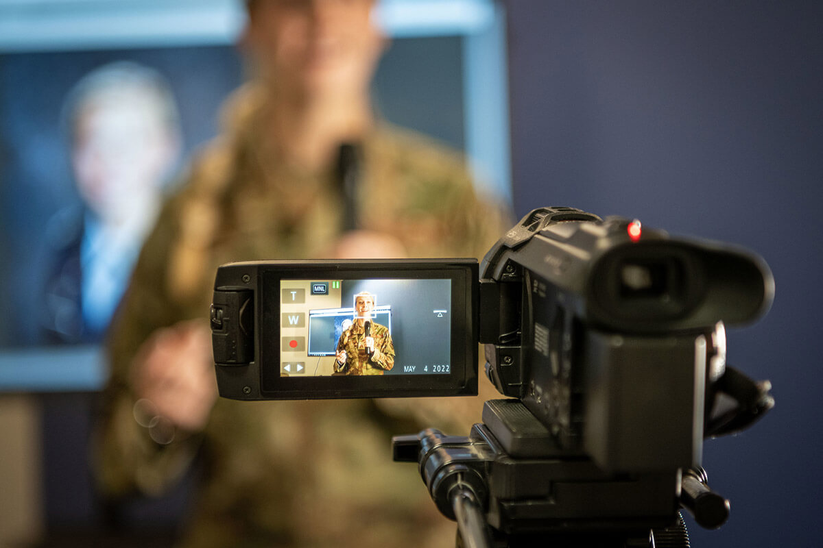 person being recorded by video camera