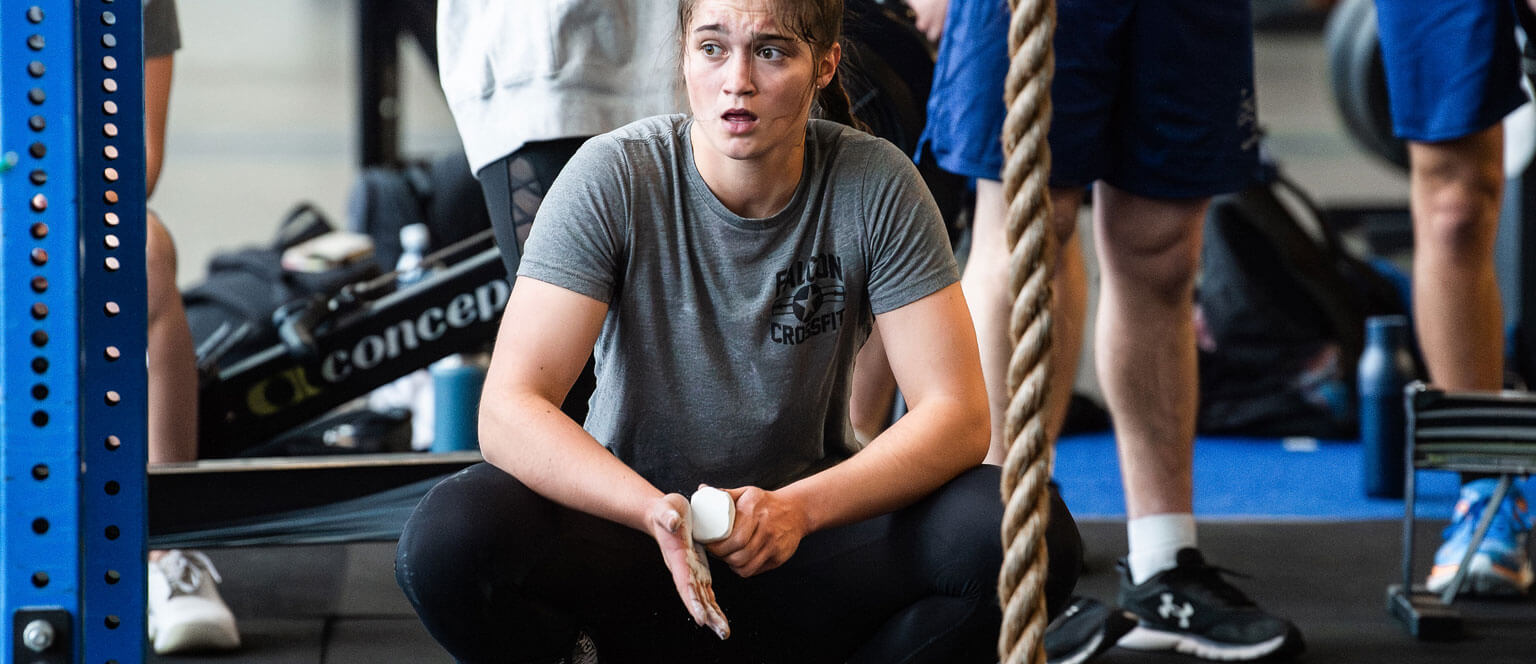 A cadet rests while training for the Falcon CrossFit Club.
