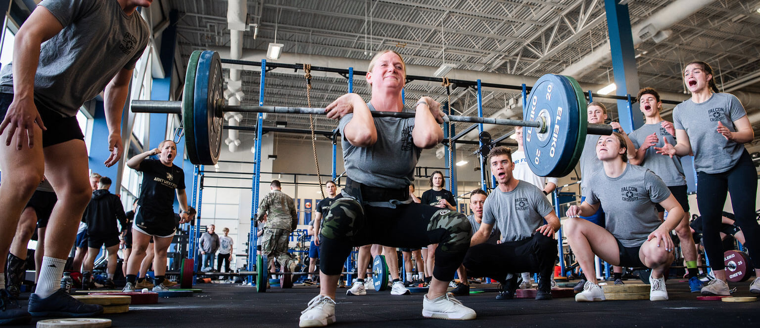 A cadet lifts weights while training for the Falcon CrossFit Club.