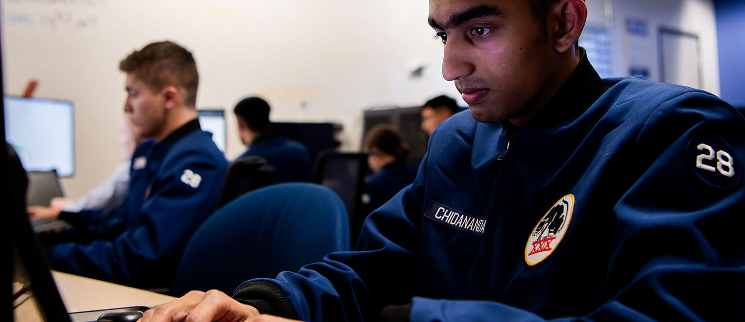 Cadets looking at data during a cyber challenge.