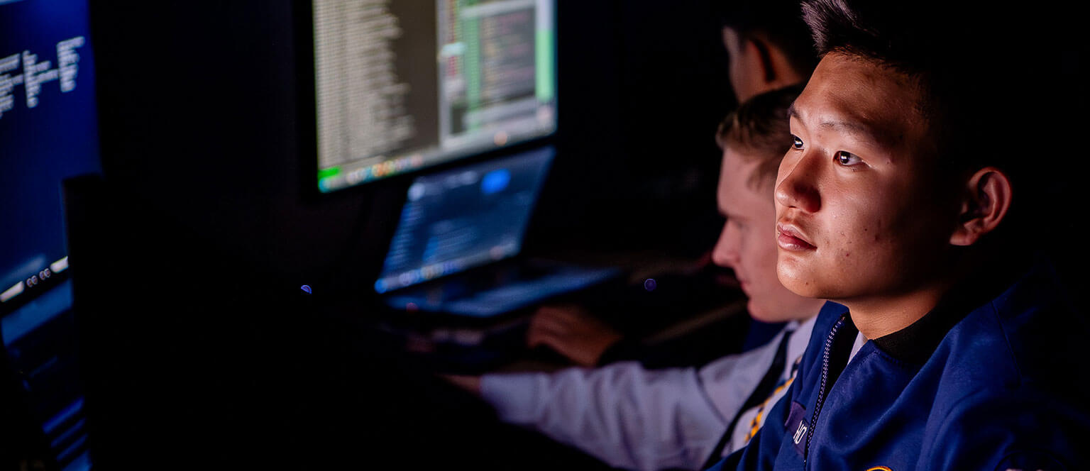 Cadets looking at data during a cyber challenge.