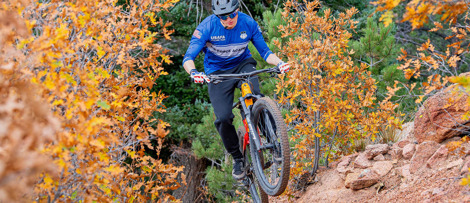 A member of the Cycling Club catches some air off of a jump.