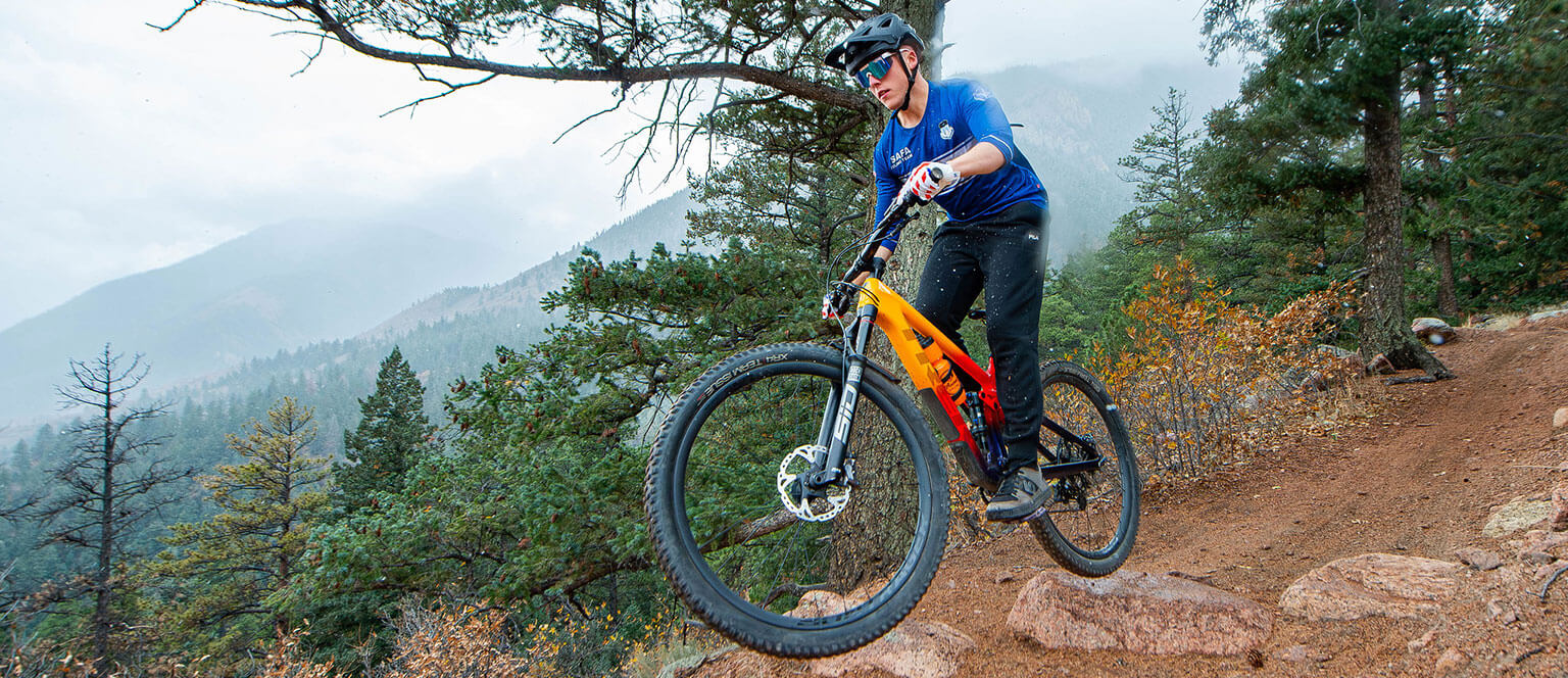 A member of the Cycling Club catches some air off of a jump.