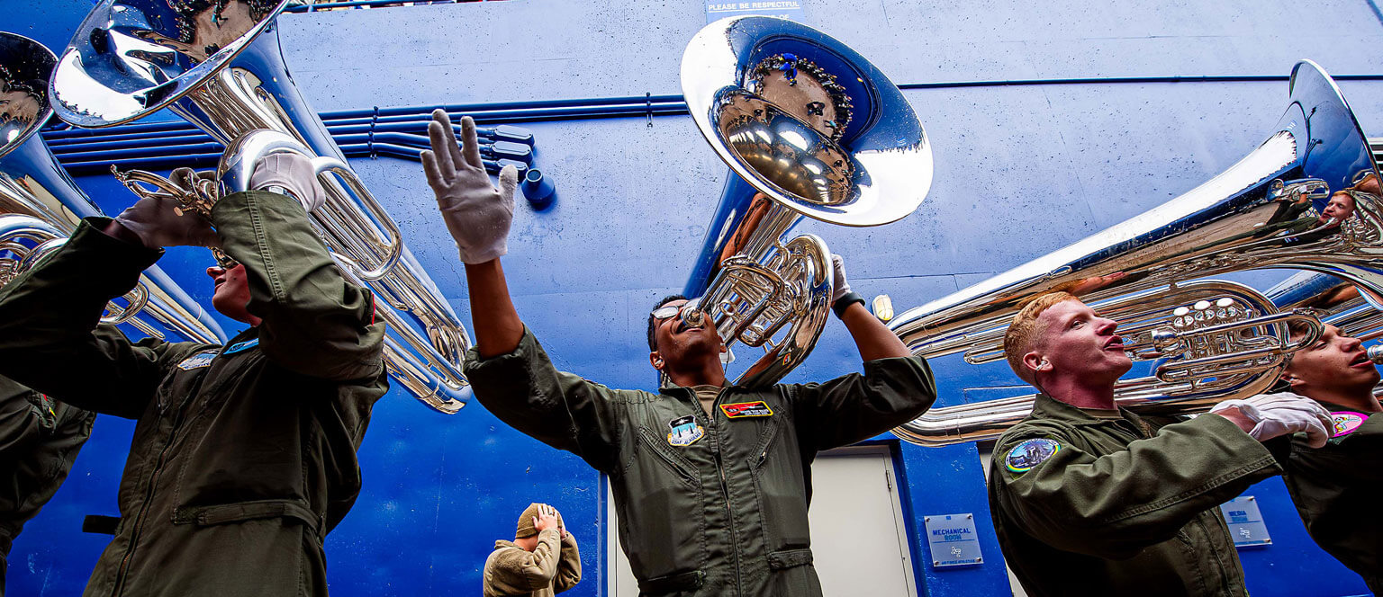 The Drum and Bugle Corp play for the football team as they enter the tunnel at Falcon Stadium.