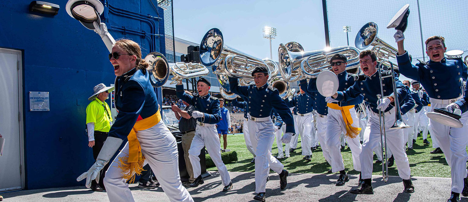 Members of the Drum and Bugle Corp rush into the tunnel at Falcon Stadium.