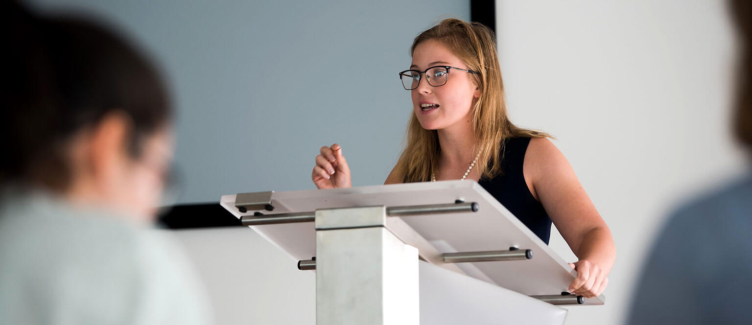 A Cadet giving a presentation at a forensics meet.