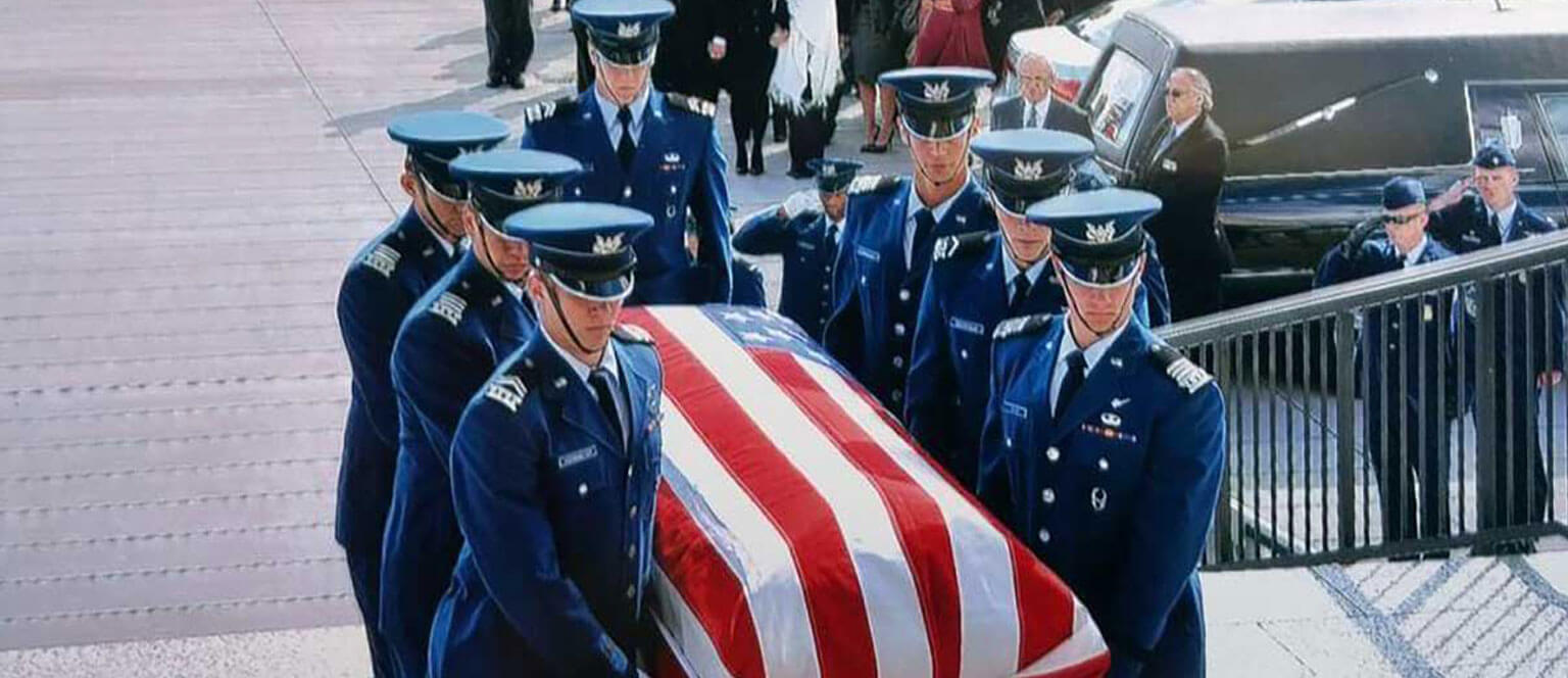 Cadet Honor Guard carrying a casket into the Academy Chapel