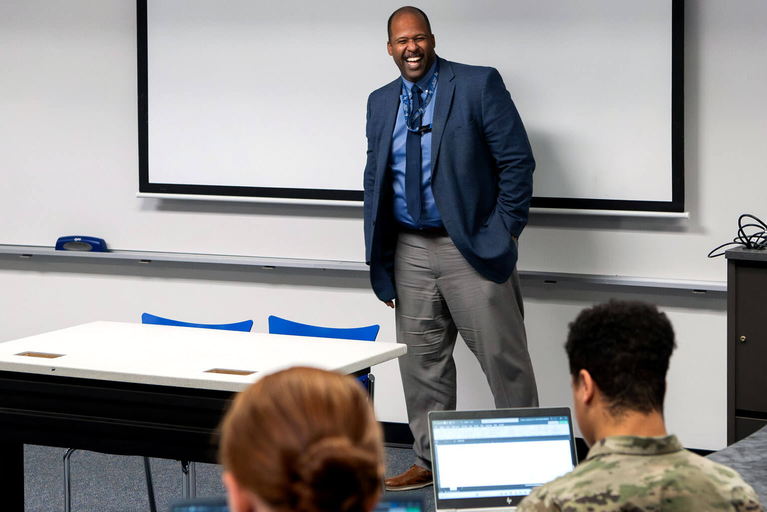 Dr. Eric Tucker laughs with cadets during a class.