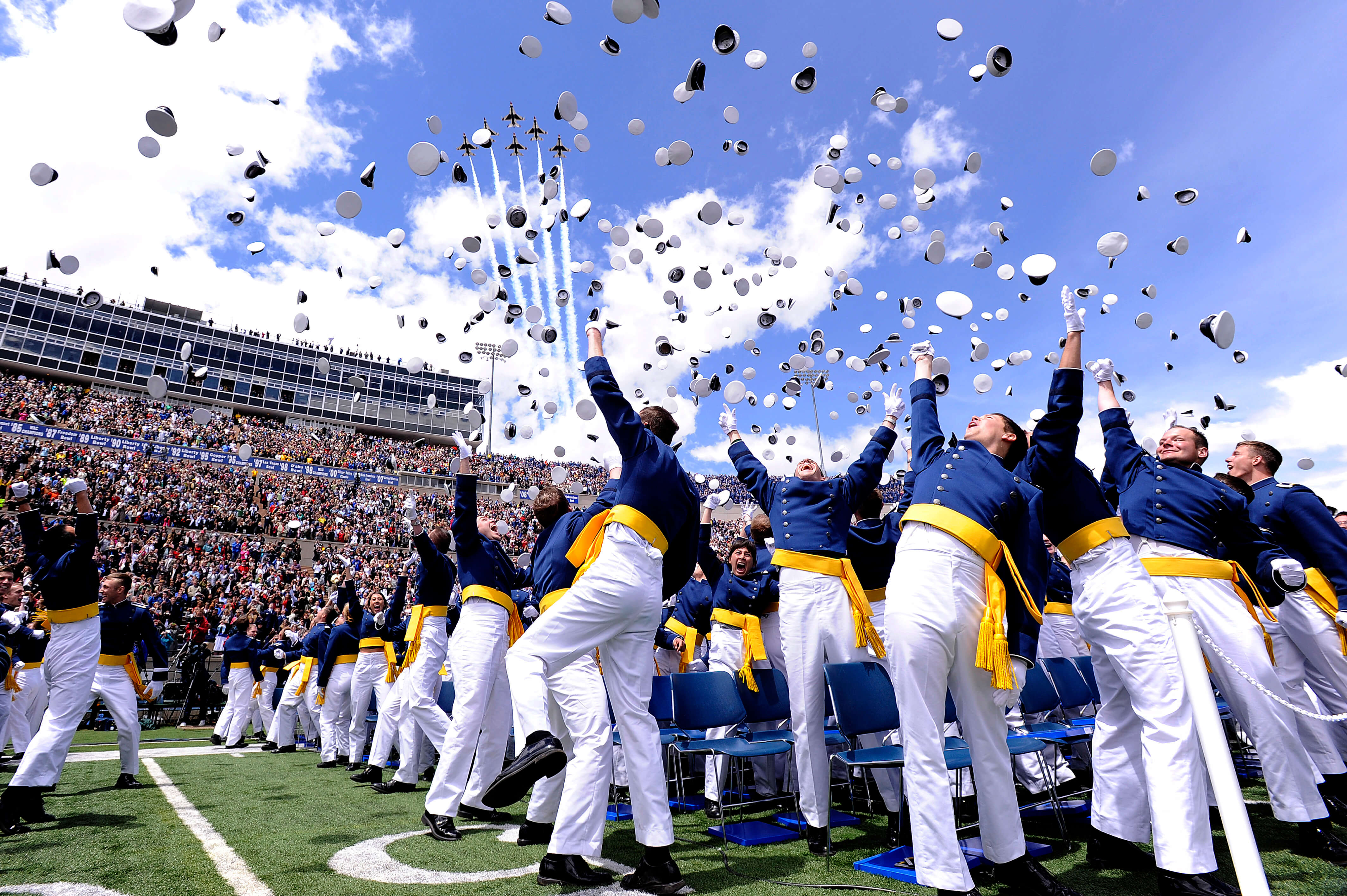 Newly commissioned second lieutenants celebrate at the end of the Air Force Academy's Class of 2011 graduation ceremony May 25, 2011