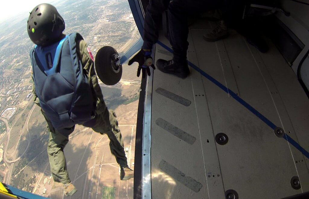 Photo of cadet skydiver jumping out of airplane during Airmanship 490