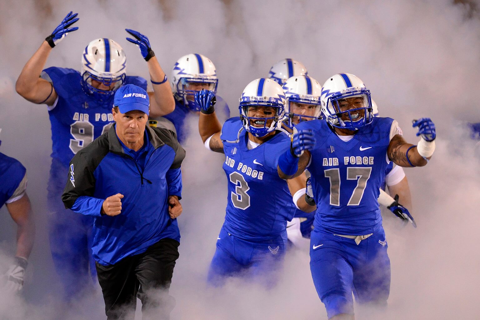 Coach and AF football team in smoke