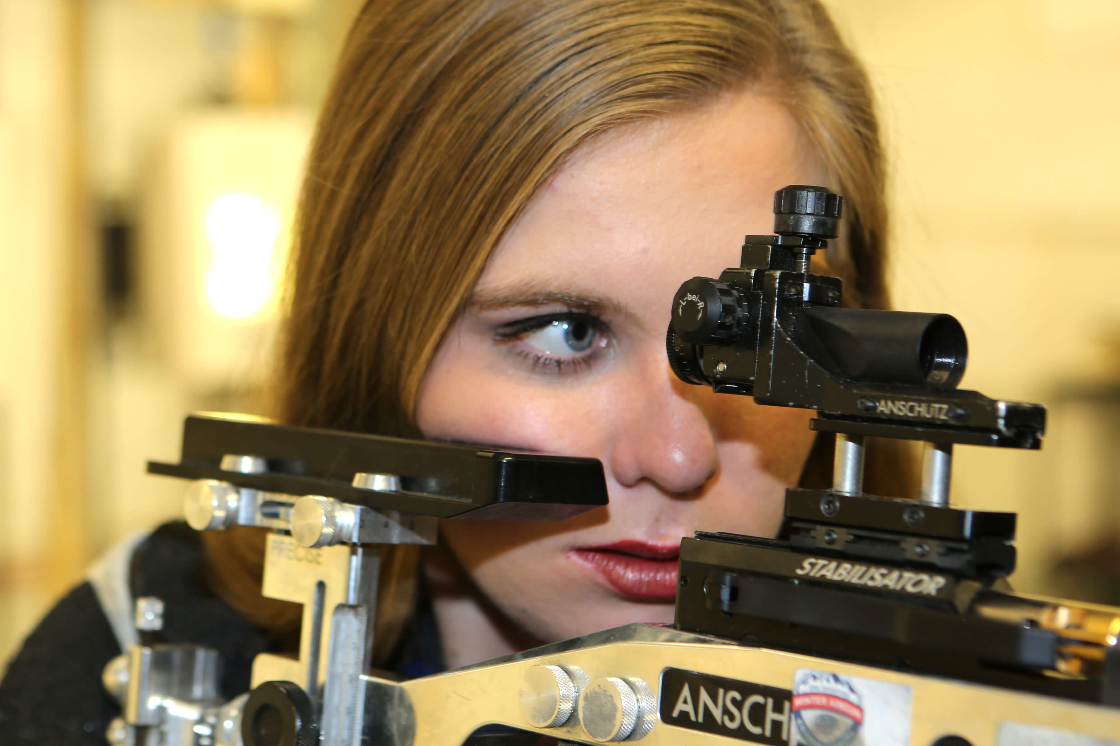 Anna Weilbacher holding rifle