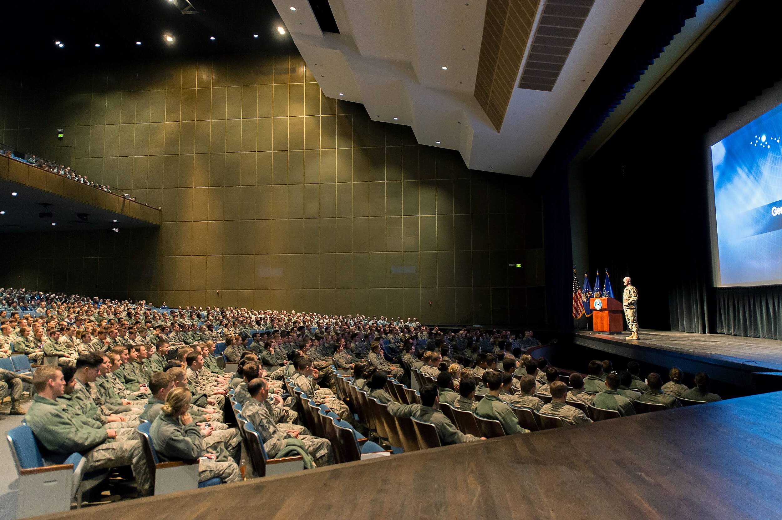 Commander of Air Force Space Command on stage talking to cadets