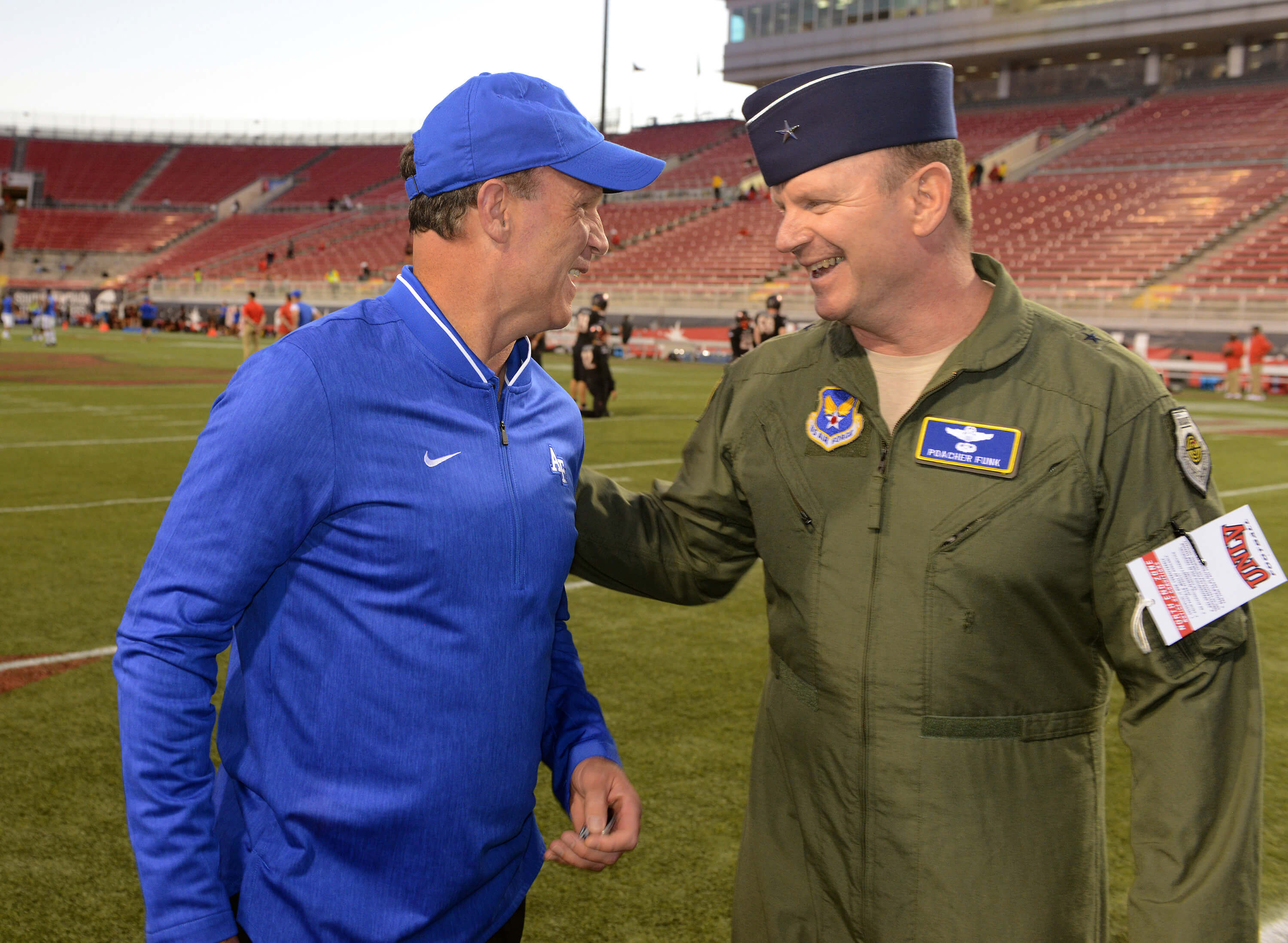Brig. Gen. Christian Funk chats with Troy Calhoun, head coach of the Air Force Falcons football team. 