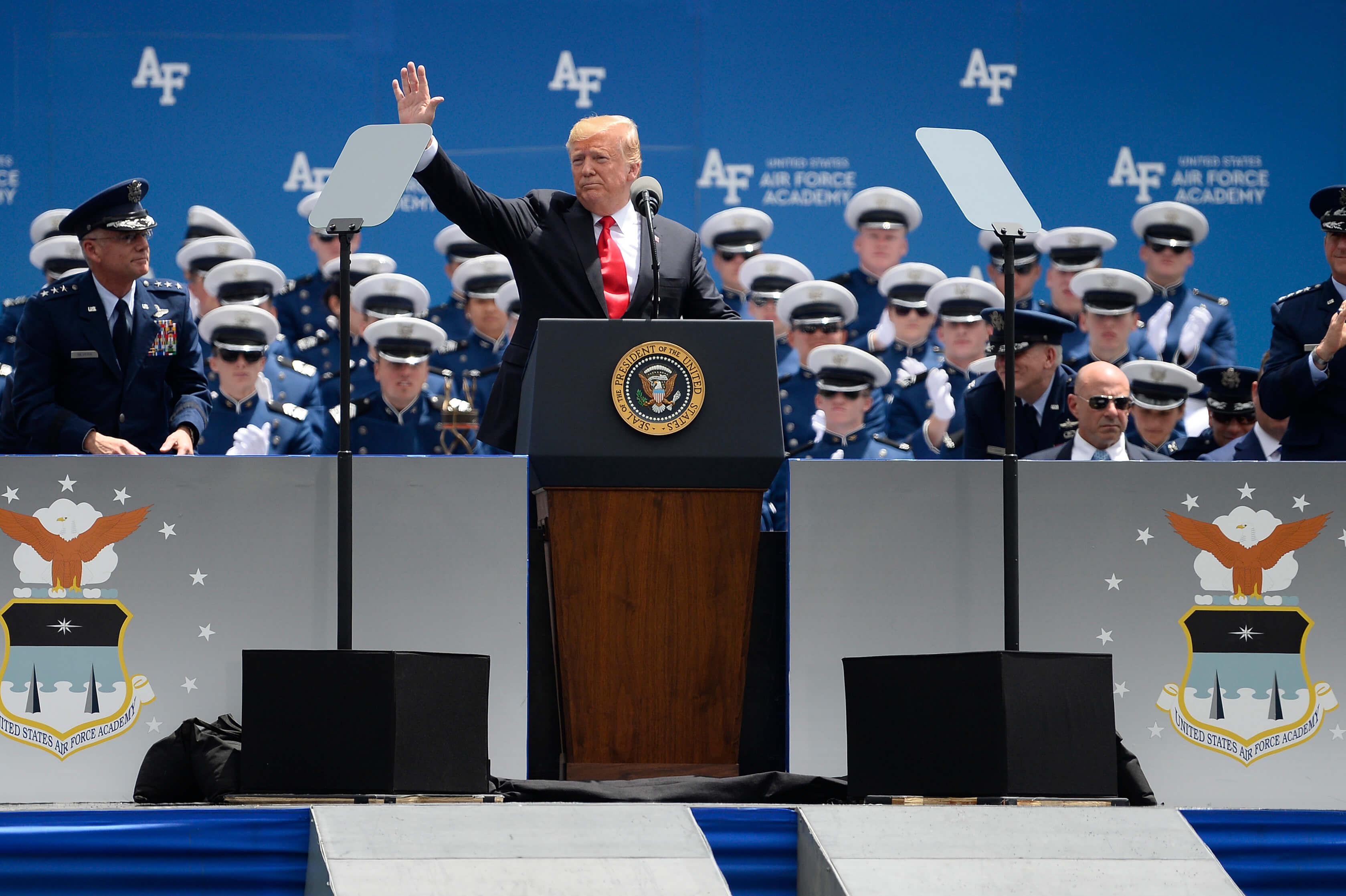 President Donald Trump waves to crowd