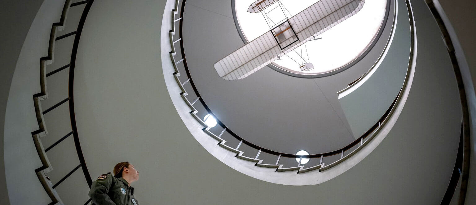 cadet looking up in library atrium