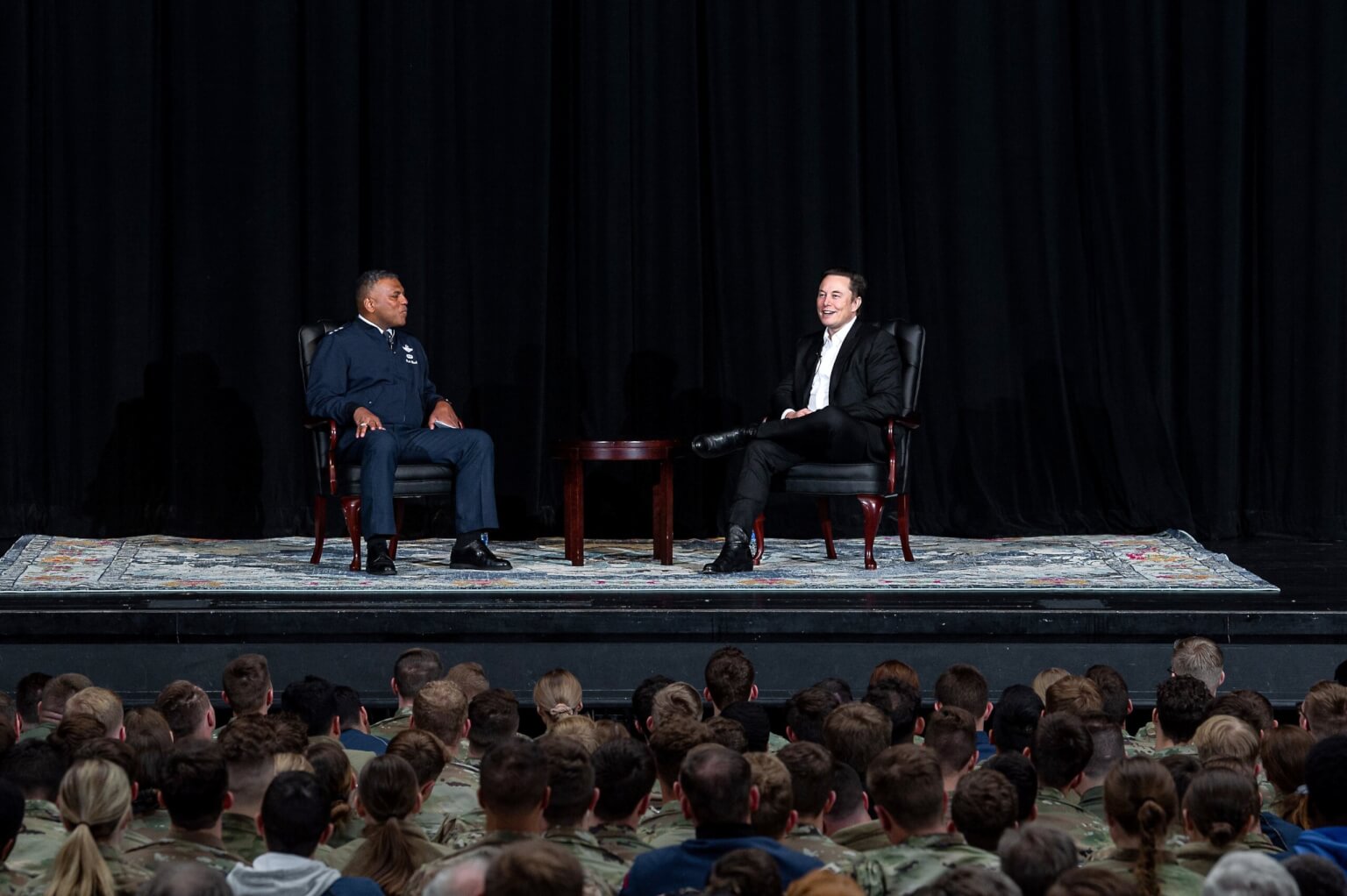 Elon Musk on stage with Lt Gen Clark