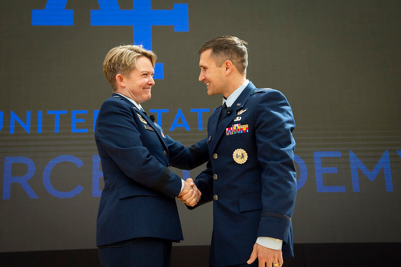 Brig. Gen. Linell Letendre, dean of the faculty at the U.S. Air Force Academy, congratulates Col. Luke Sauter,