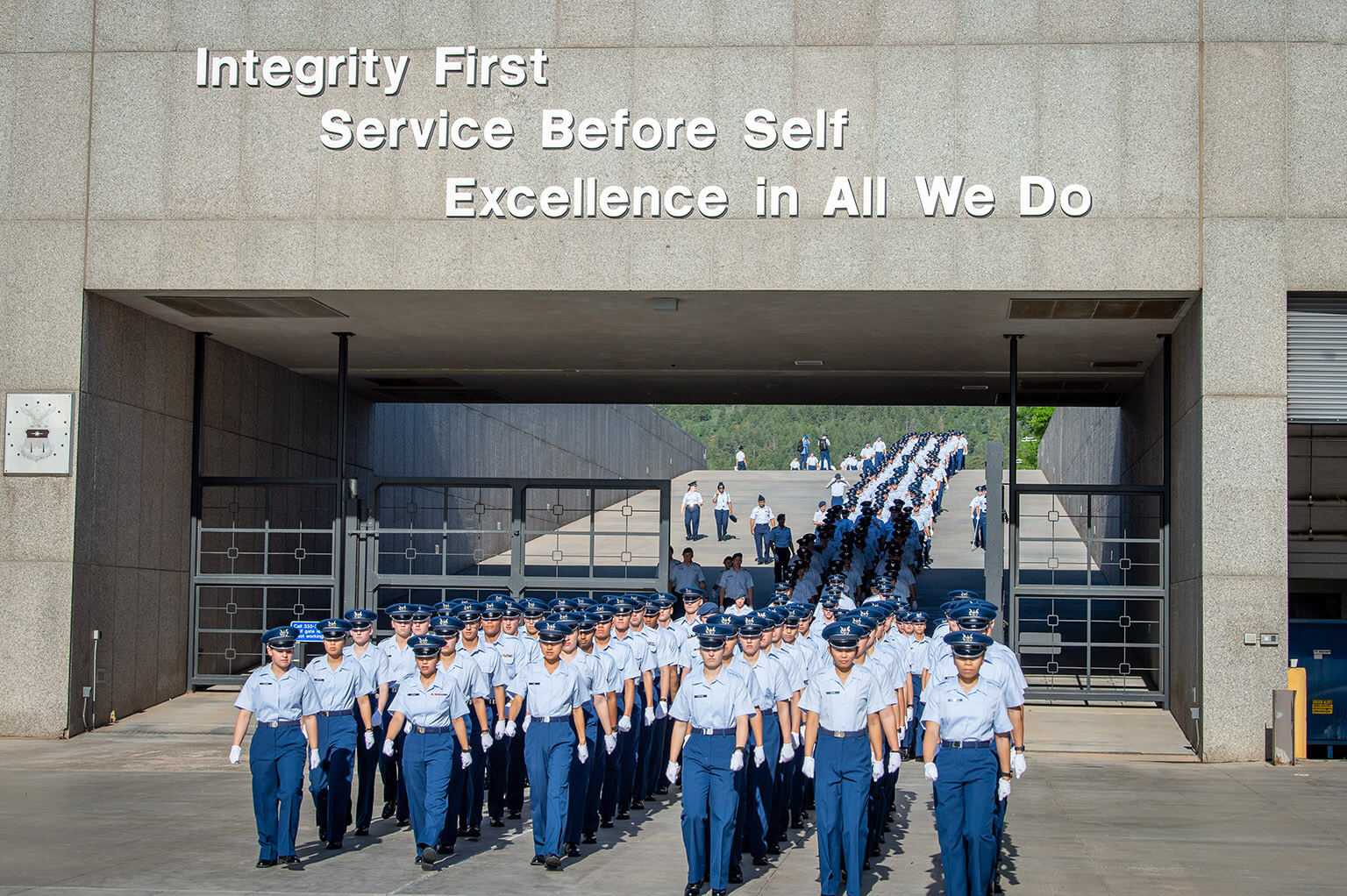 Cadets in formation beneath Honor Wall