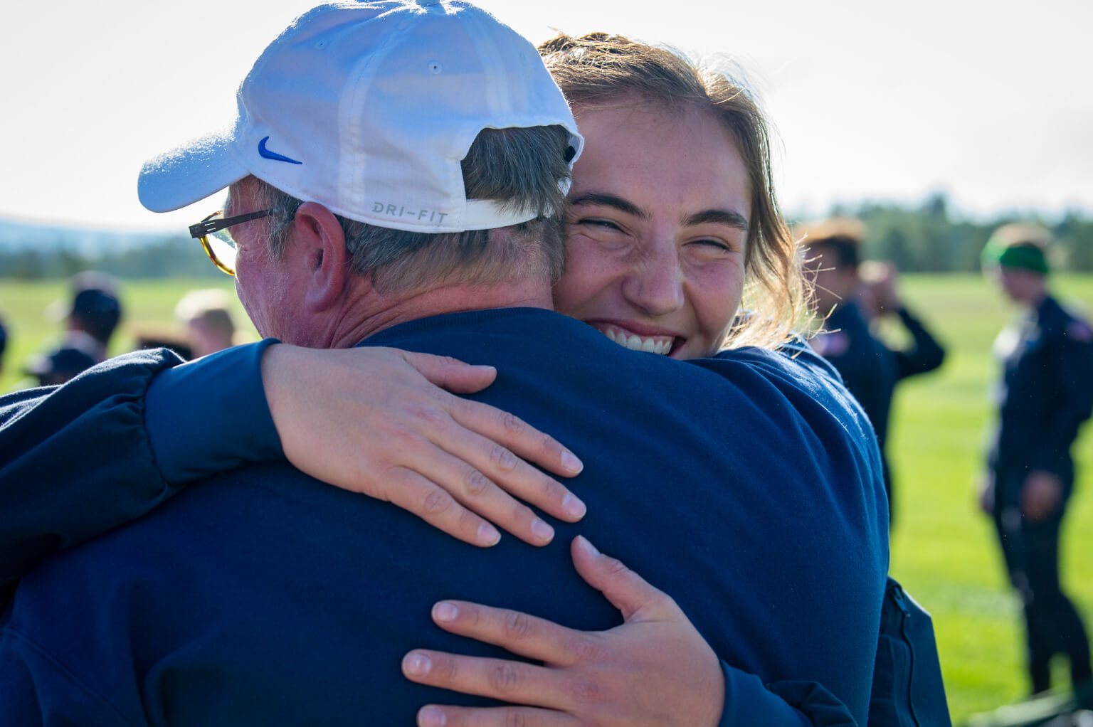 family- daughter hugs father