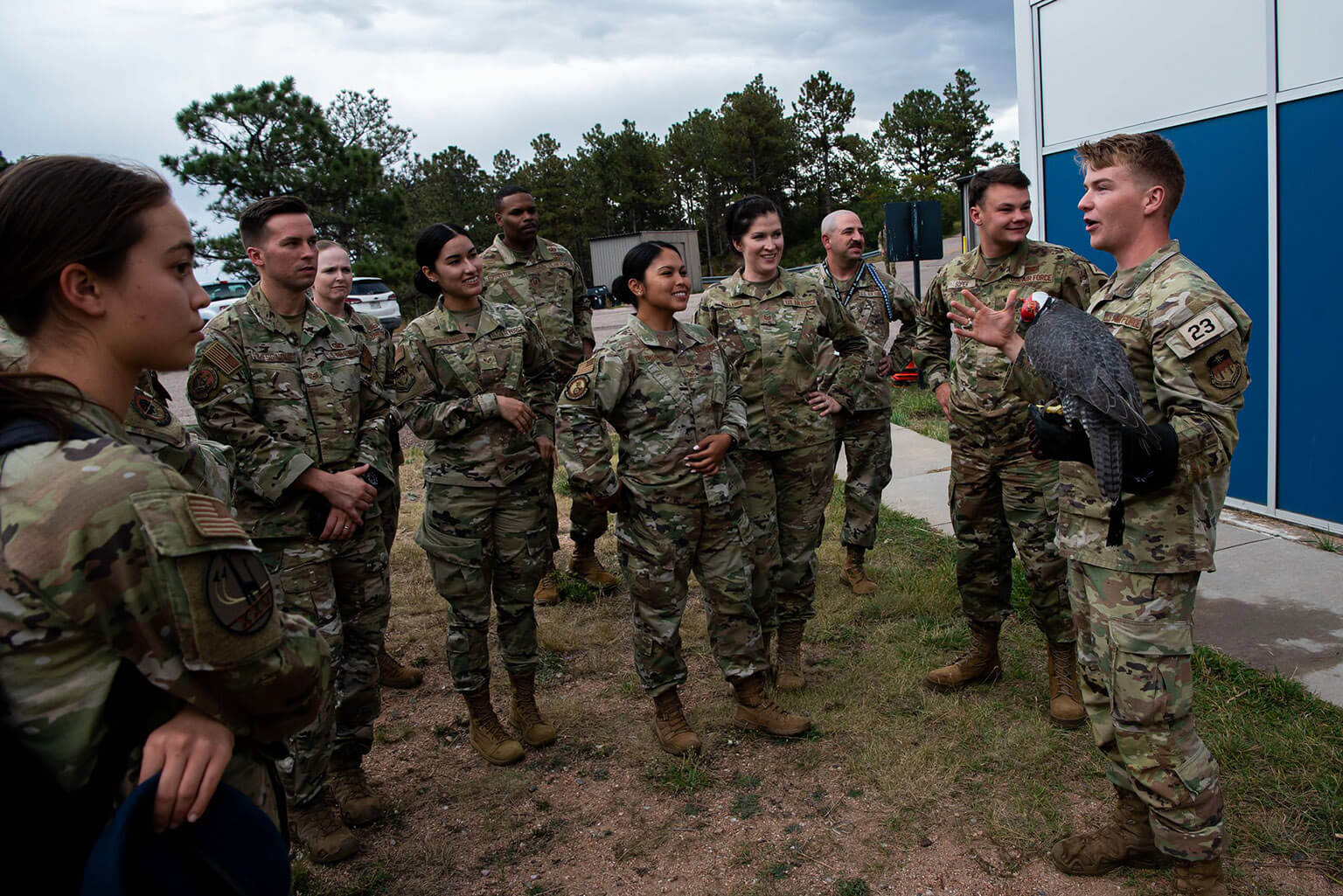 12 Outstanding Airmen of the Year view a demonstration by the cadet falconry club