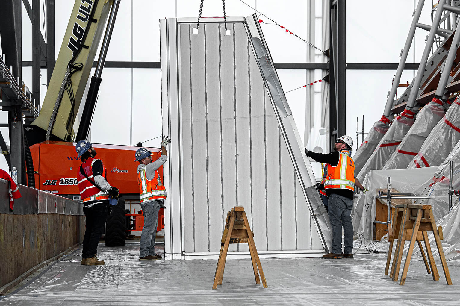 Contractors lowering panel at Cadet Chapel