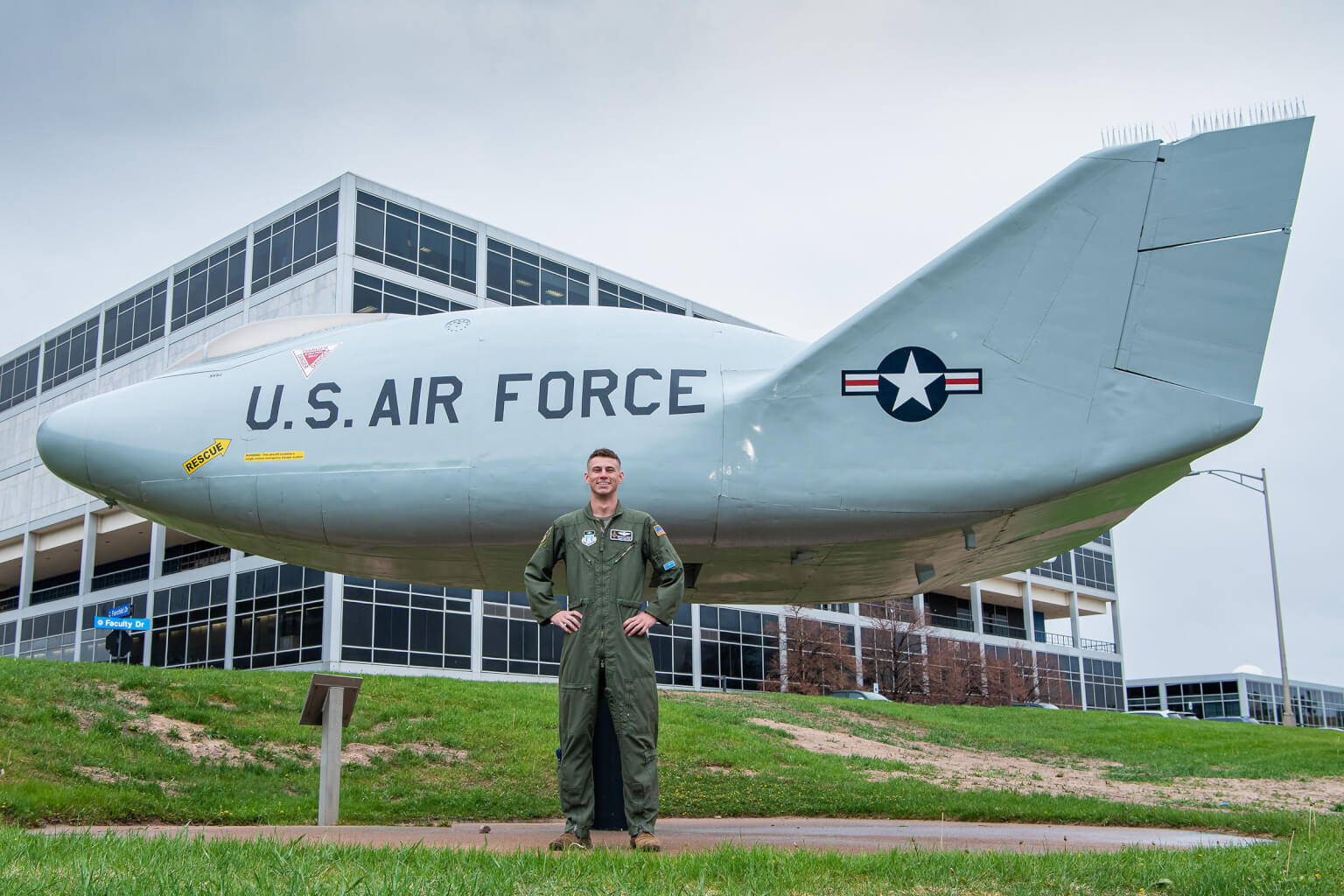 2nd Lt. Nicholas X. Hawley stands in front of the Martin-Marietta SV5-J Lifting Body.