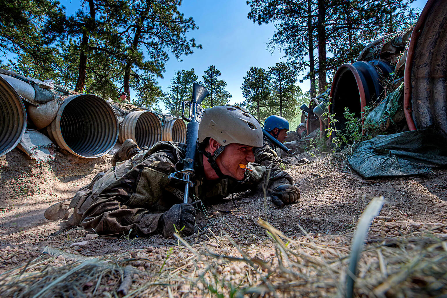 Class of 2027 cadet crawling on ground in BCT