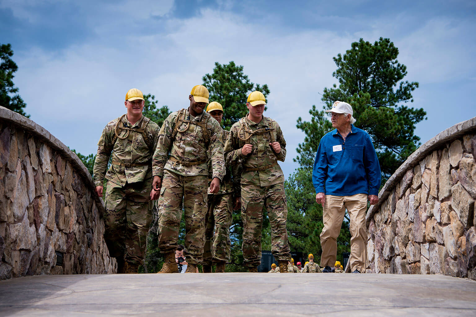 Retired Lt. Col. Curtis Cook, a U.S. Air Force Academy Class of 1959 graduate, talks to Class of 2027 cadets on the Challenge Bridge