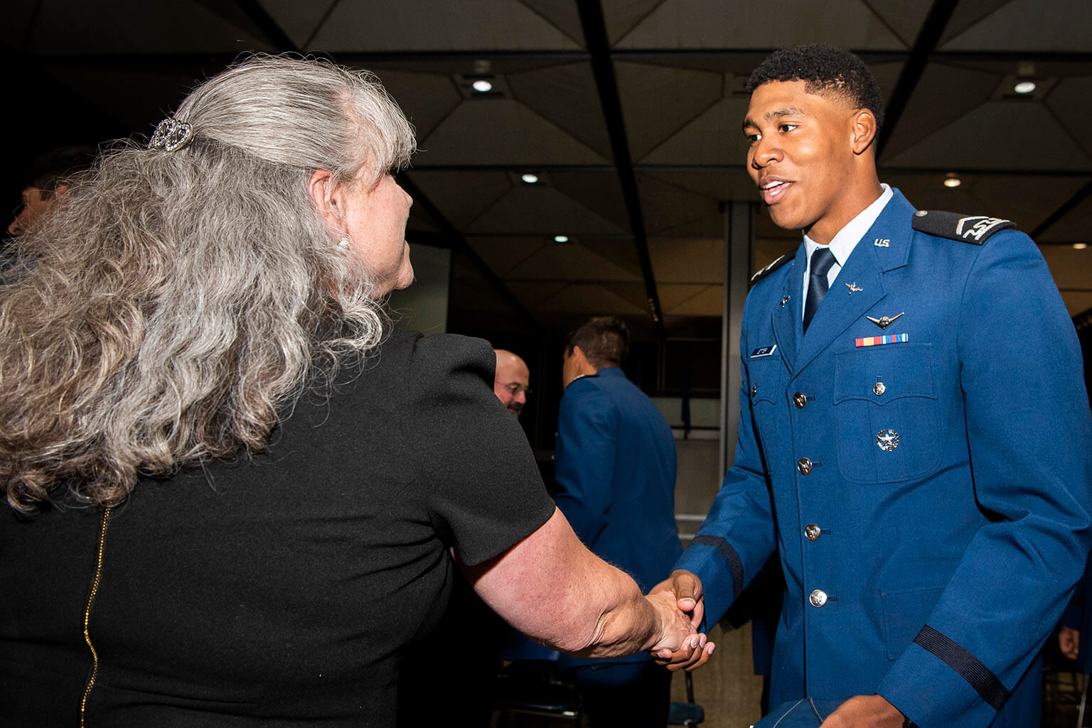 Lori Longfritz greets U.S. Air Force Academy Cadet 3rd Class Christian Jetter 