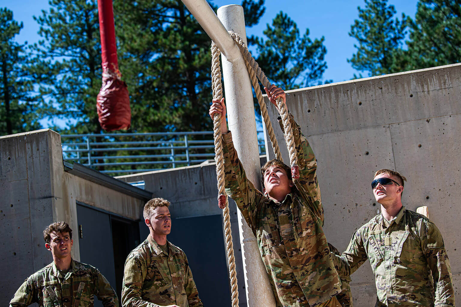 Special Warfare Club cadets negotiate the Leadership Reaction Course at Jacks Valley