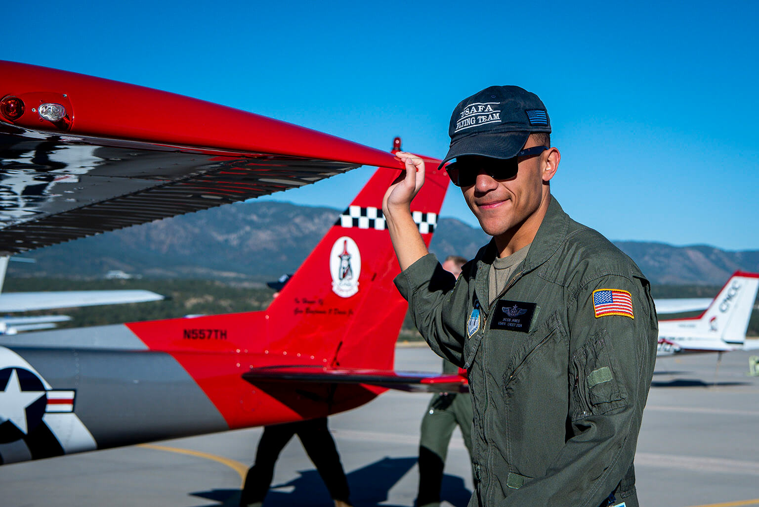 Cadet 1st Class Jacob James poses in front of the T-51A Deathhawk