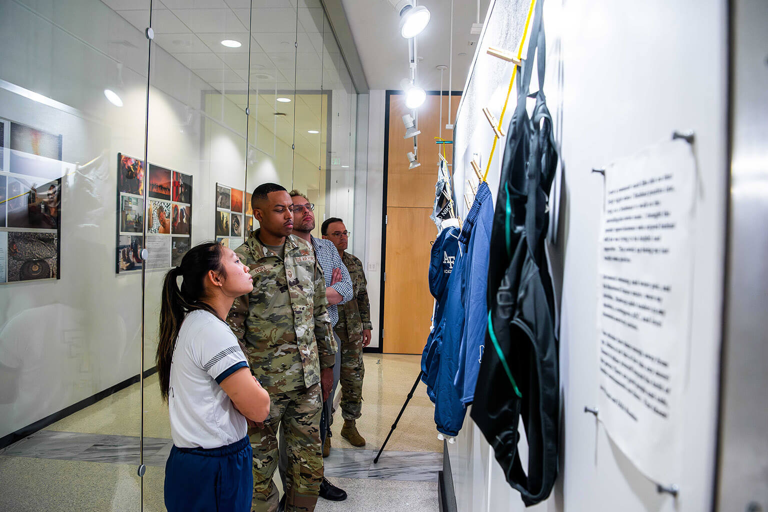 U.S. Air Force Academy cadets and permanent-party active duty U.S. Air Force members view The Clothesline Project on display