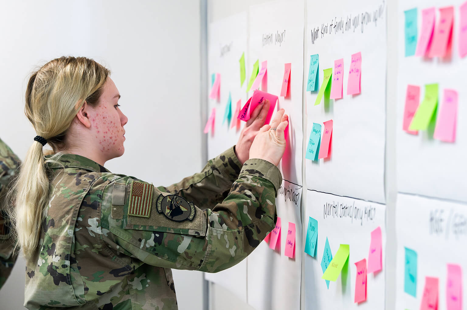 Force Academy cadet uses sticky notes as part of the problem-solving process 