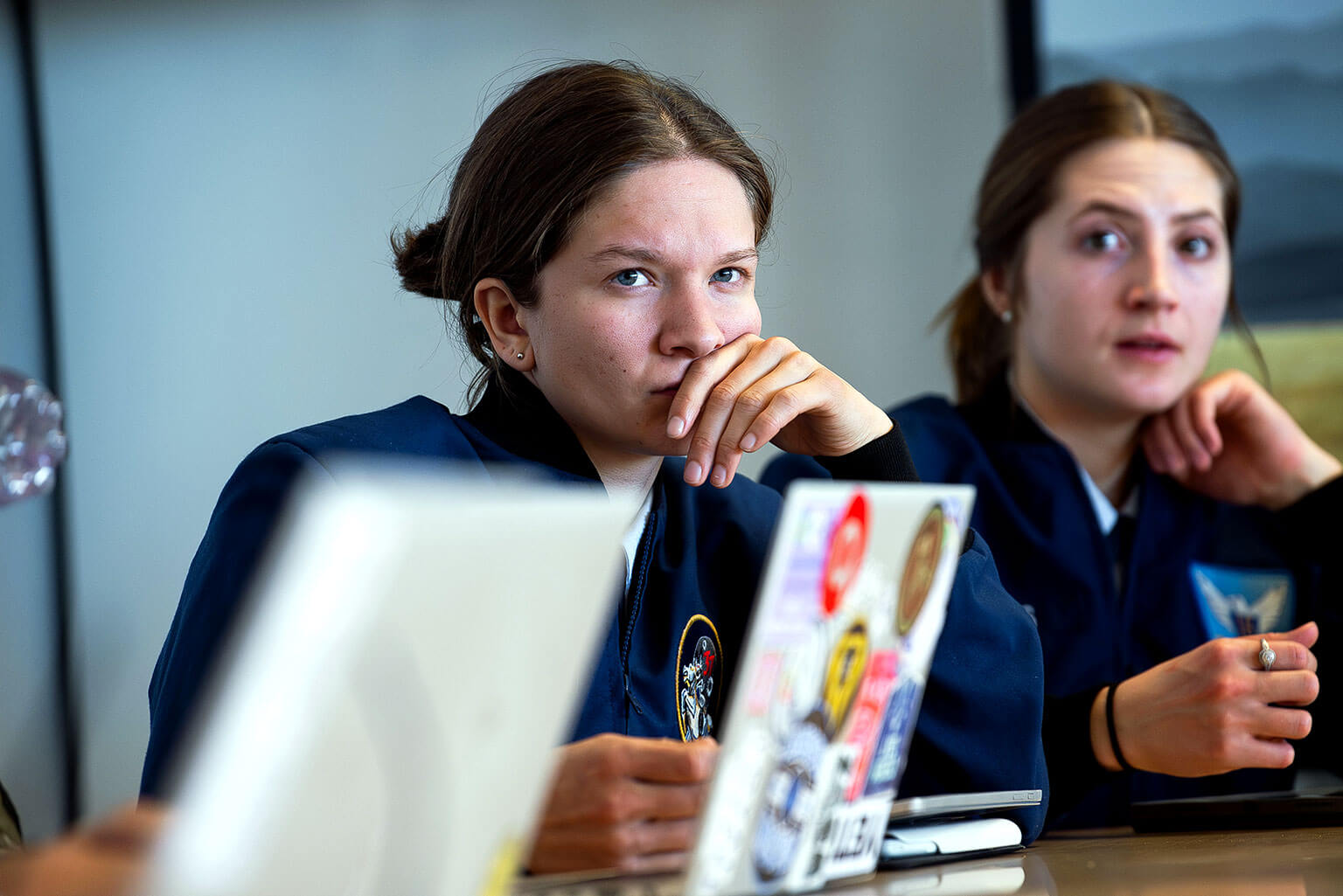 Cadet 2nd Class Alyssa Hargis, left, and Cadet 1st Class Olivia Hommes, consider options for a proposed solution to their team’s problem in the U.S. Air Force Academy’s “Reflecting on Wicked Problems” capstone course.