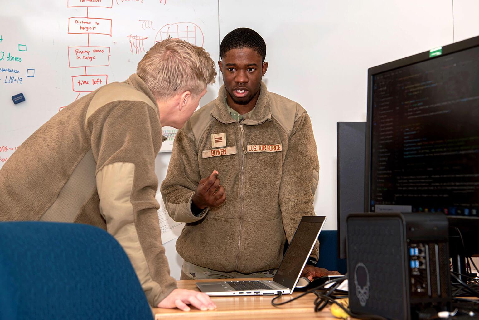 Cadets 1st Class Mason Rolph and Jabari Bowen discuss modifications for the drone in the Department of Electrical and Computer Engineering.