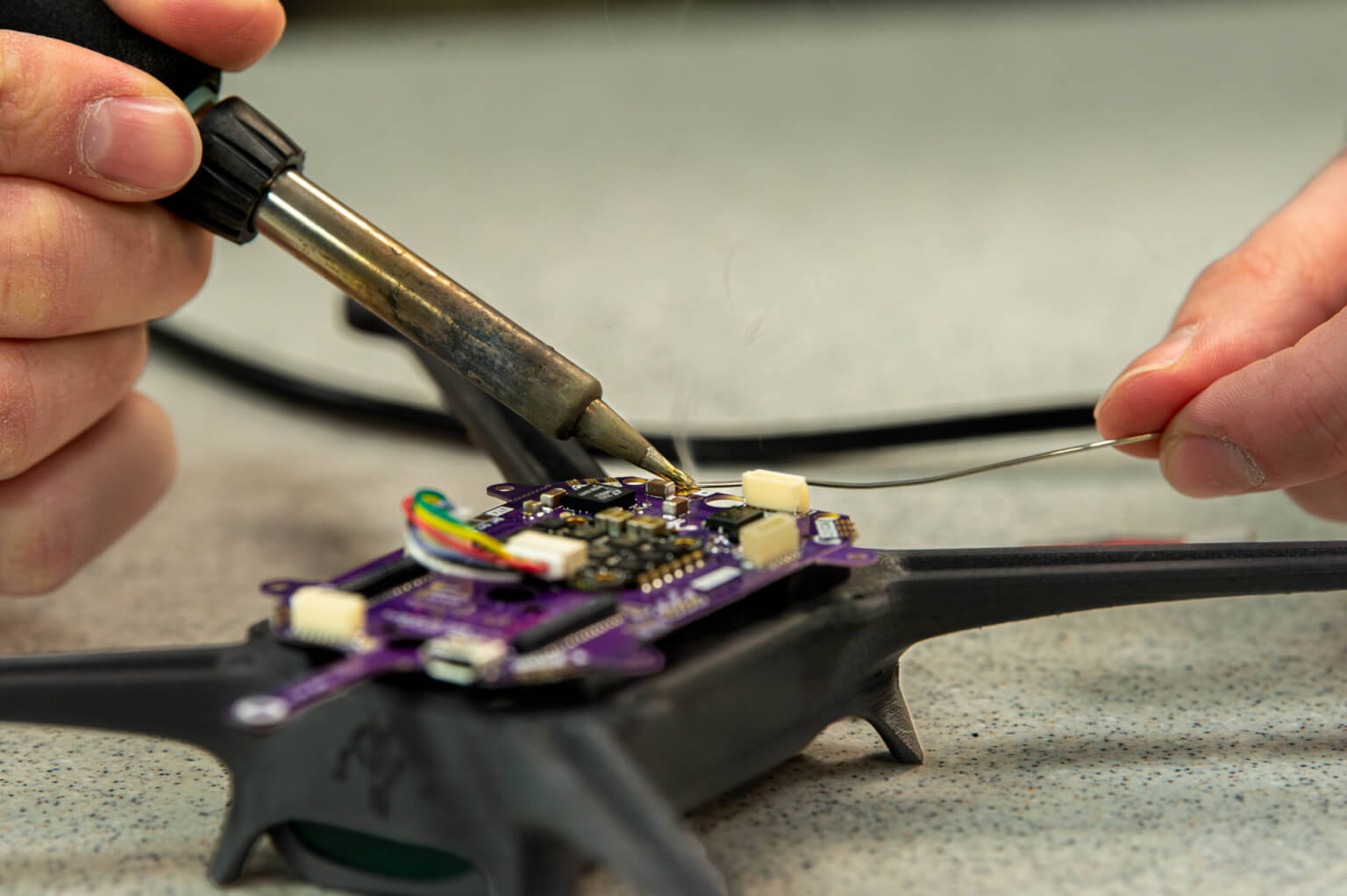 Cadet 1st Class Marcus Sander modifies a drone in the Department of Electrical and Computer Engineering.