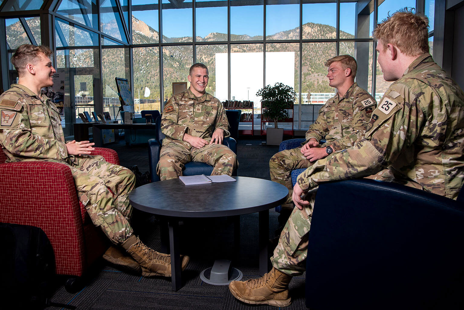 Cadet 1st Class Sam Wolf talks with Cadet 2nd Class Brooks Gable, left, and Cadet 2nd Class Jack Ganos in Exemplar Hall.