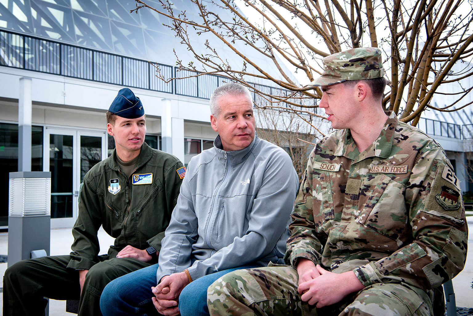 Cadet 2nd Class Chad Schuch Jr., left, and Cadet 4th Class Dylan Schuch pose with their father outside Polaris Hall.