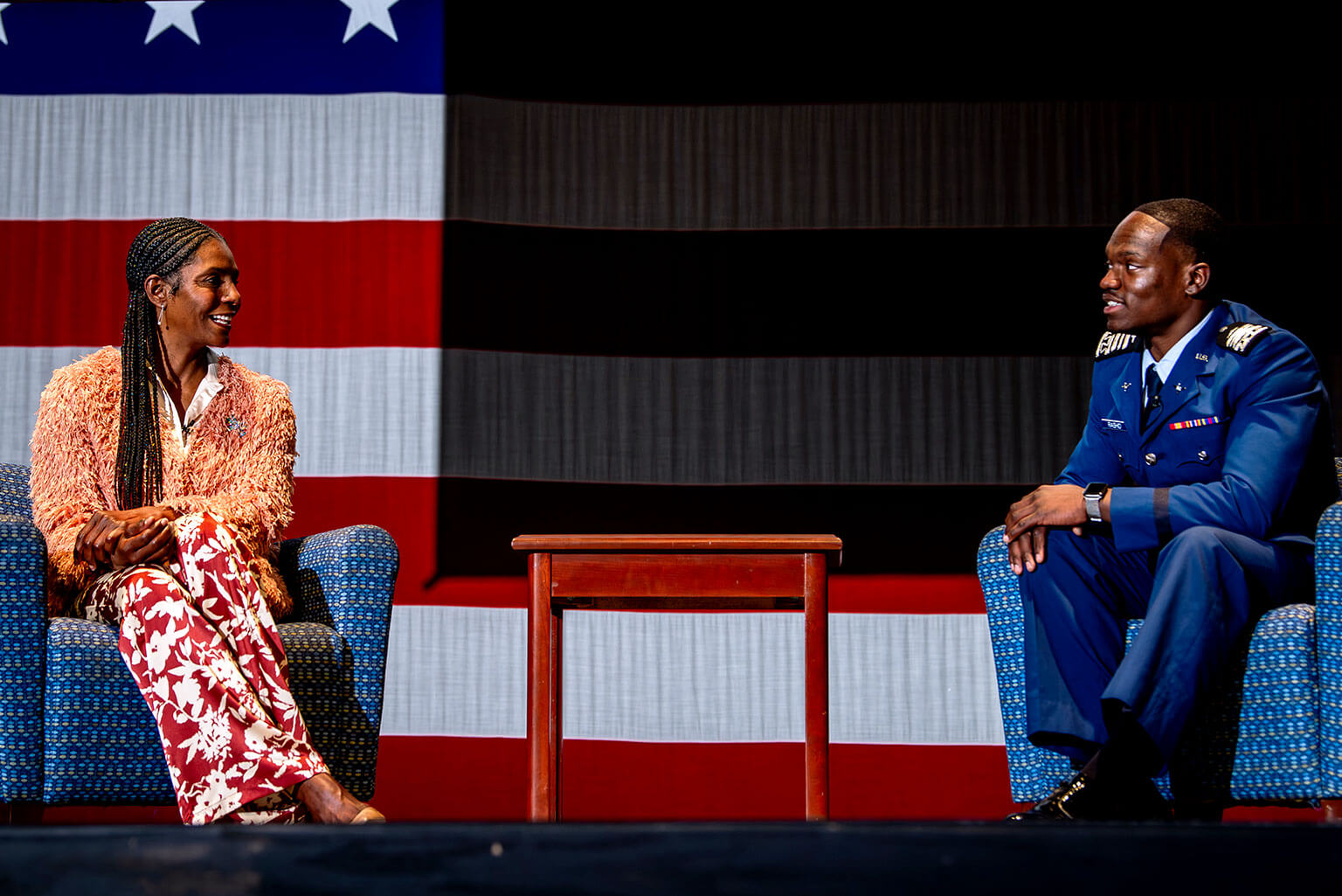 Wounded Warrior Project’s Warriors Speak spokesperson Tonya Oxendine speaks with Cadet 1st Class Nasir Rashid on stage at Arnold Hall.