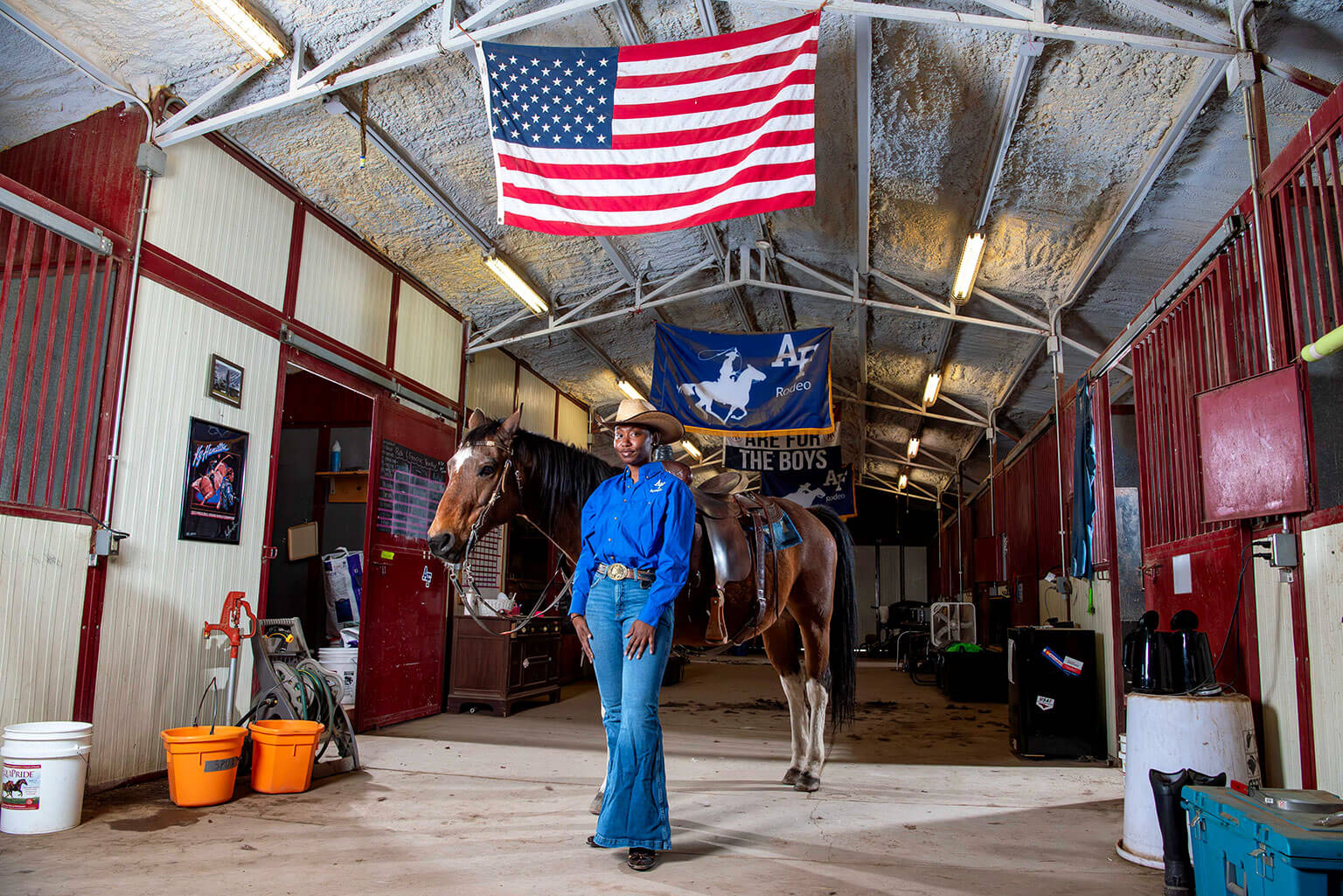 Cadet 3rd Class Lauryn Mitchell poses in front of her horse at the U.S. Air Force Academy Rodeo Club.