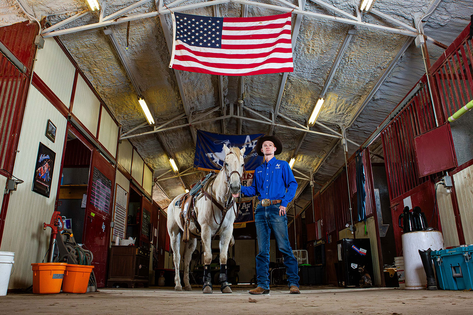 Cadet 1st Class Robert Ball poses with his horse, Ferg, out of the U.S. Air Force Academy Rodeo Club barn.