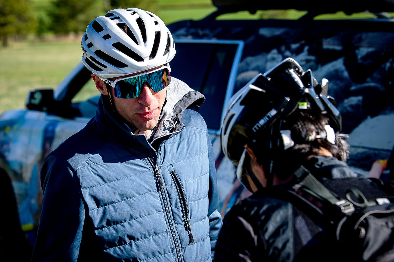 Cadet 1st Class Sean Maison speaks with another bicyclist during U.S. Air Force Academy’s Bike to Work Day.