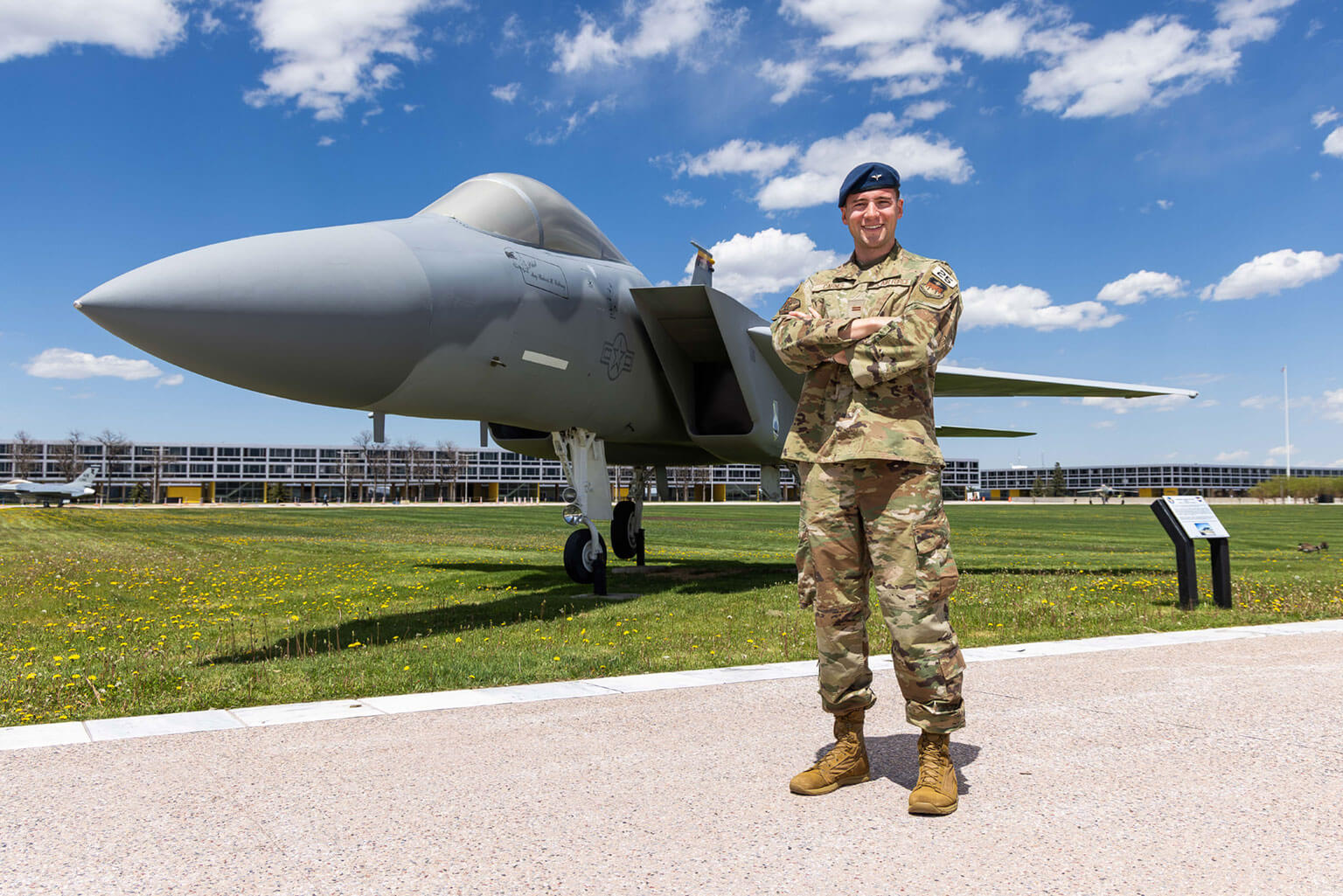 Then-Cadet 1st Class Mark Carnes, Class of 2025, is pictured in front of the F-15 Eagle on the U.S. Air Force Academy Terrazzo.