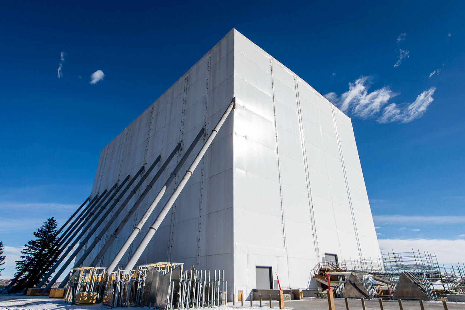 A white box encases the Cadet Chapel as extensive renovations continue at the U.S. Air Force Academy, Colo., July 23, 2025. The structure, erected in September 2019, allows work to proceed in harsh weather and has withstood winds up to 100 mph. (U.S. Air Force photo by Trevor Cokley)