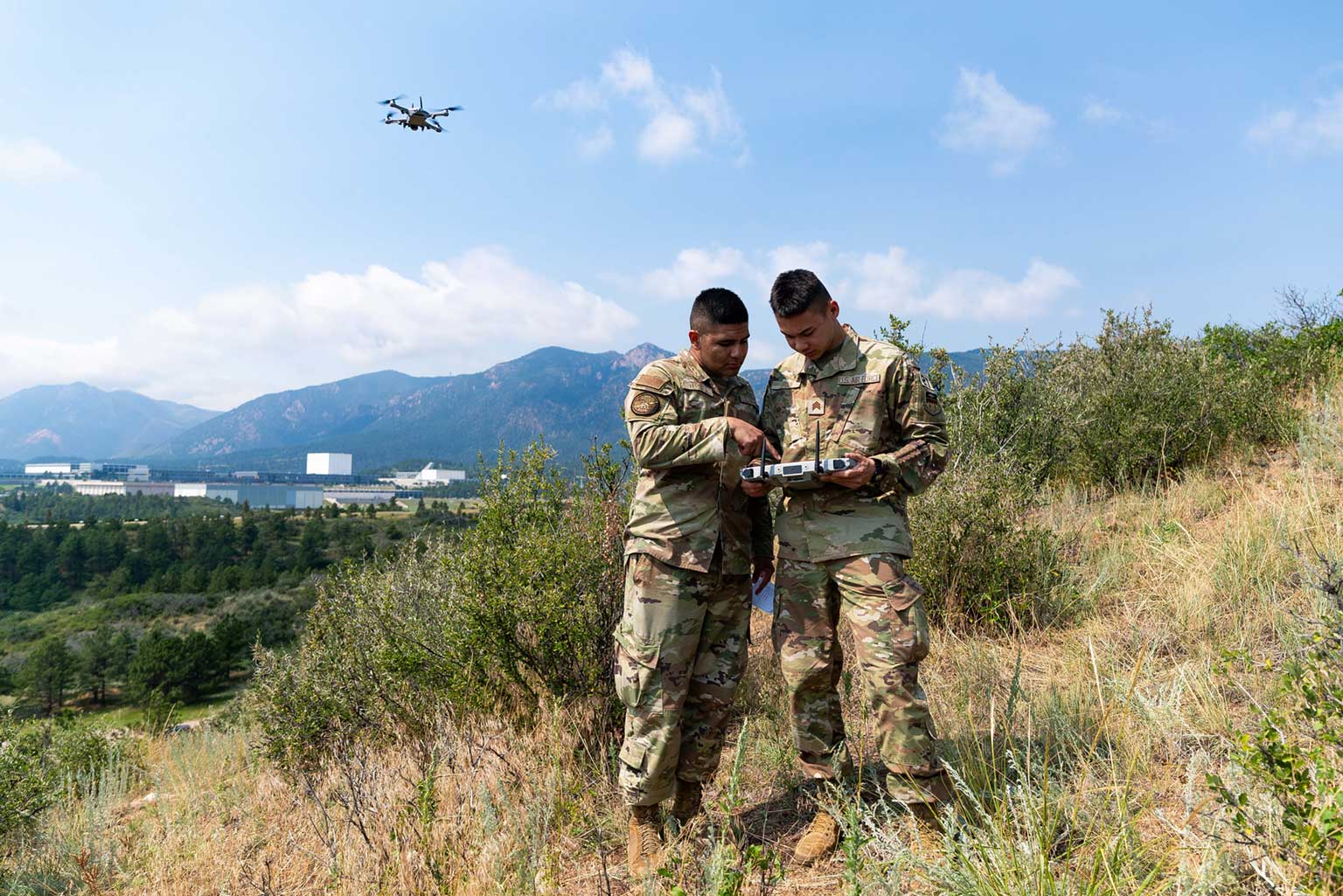 Cadet 2nd Class Angel Herrera and Cadet 2nd Class Jason Poon conduct aerial reconnaissance using a small Unmanned Aerial System during the Cadet Warfighter Instructor Course.