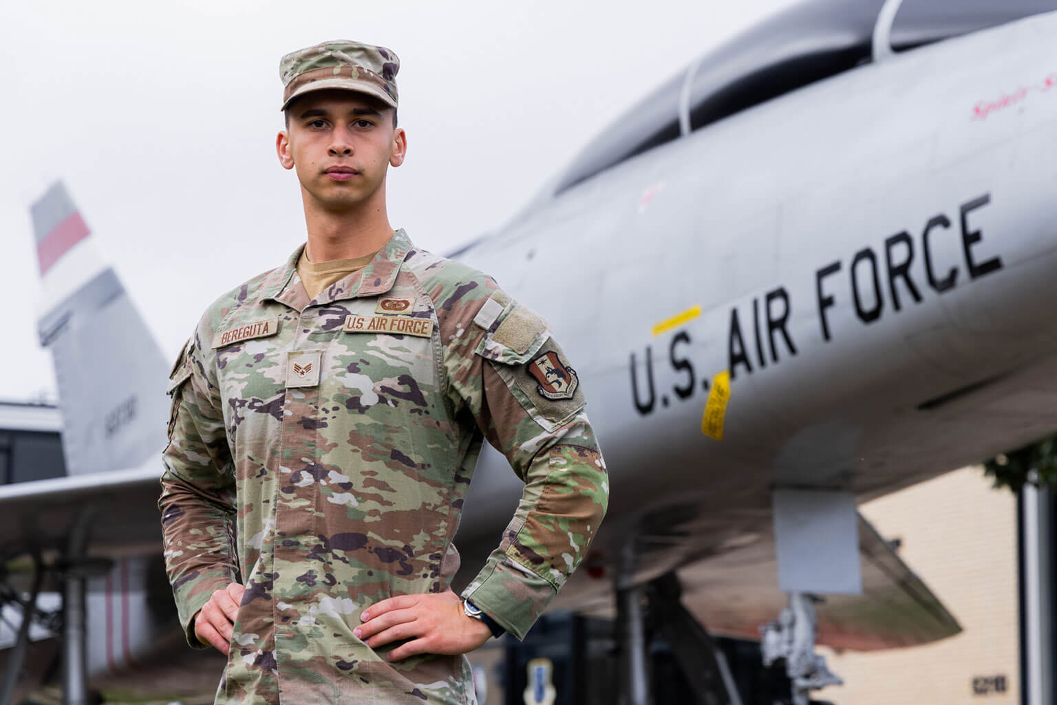 Then-Cadet Candidate Roman Bereguta, wearing the insignia of his prior enlisted rank of senior airman, poses for a photo near a static aircraft display at the U.S. Air Force Academy Preparatory School, Colo., Aug. 26, 2025. Bereguta earned his Prep School nomination through the Leaders Encouraging Airmen Development program after serving at Peterson Space Force Base, Colorado. (U.S. Air Force photo by Trevor Cokley)