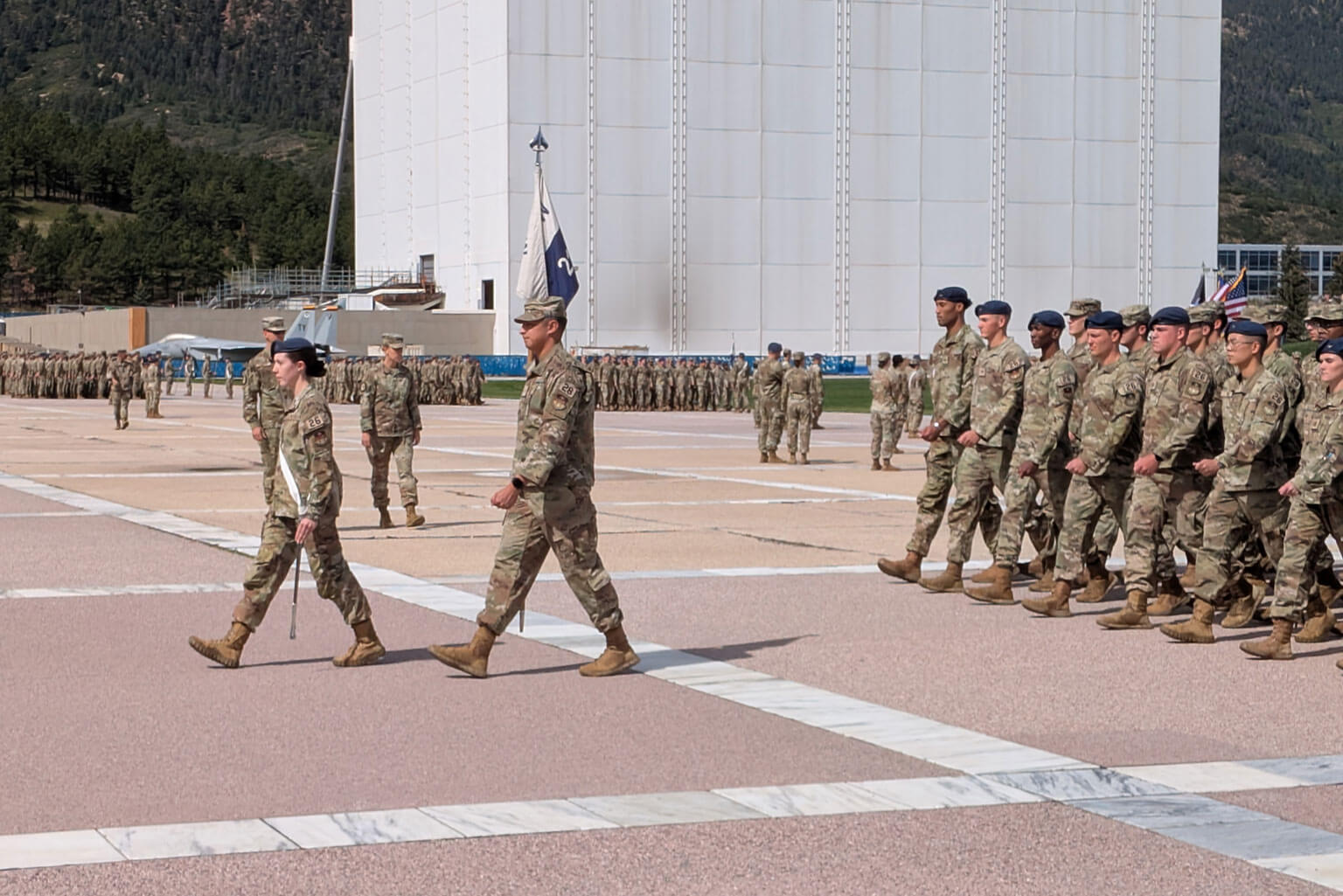 Cadet 1st Class Jane Santamore, Squadron 26 commander, Cadet Wing, leads her squadron during noon meal formation at the U.S. Air Force Academy, Sept. 19, 2025. This daily formation, a leadership responsibility for cadet commanders, reinforces discipline and unit cohesion as cadets march in formation to Mitchell Hall for lunch. (U.S. Air Force photo by Sonie Rathbun)