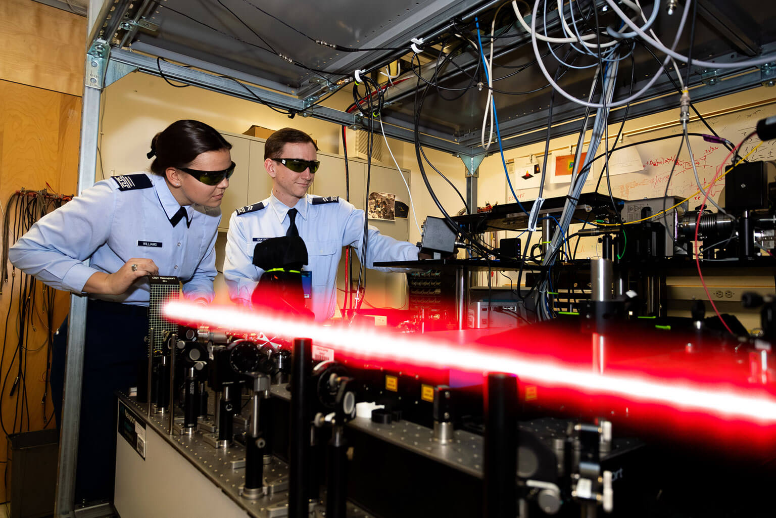 Cadet 1st Class Emma Williams and Cadet 2nd Class Jacob Grayson align an optical track to maximize laser power at the Laser and Optics Research Center, U.S. Air Force Academy, Colo., Jan. 13, 2026. The Quantum Technologies minor integrates physics, computer science and engineering to prepare cadets for future operational and technical leadership roles. (U.S. Air Force photo by Ray Bahner)