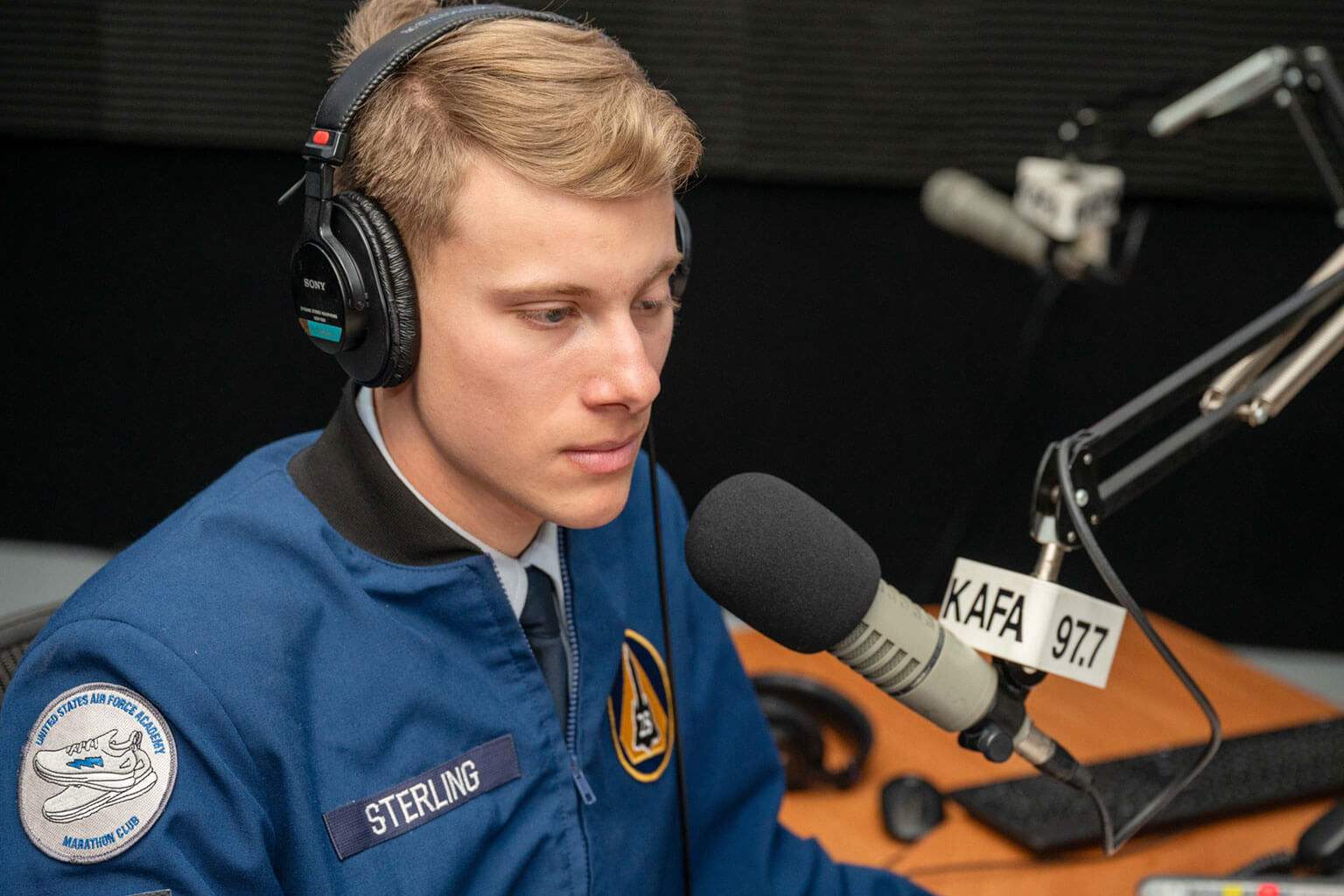 Cadet 3rd Class Jude Sterling, KAFA disc jockey or DJ, records a radio show at Fairchild Hall, U.S. Air Force Academy, Colo., Jan. 20, 2026. KAFA allows cadet DJs an opportunity to hone their communication skills while telling the Academy story to thousands of worldwide listeners. (U.S. Air Force photo by Tech. Sgt. Zach Vaughn)